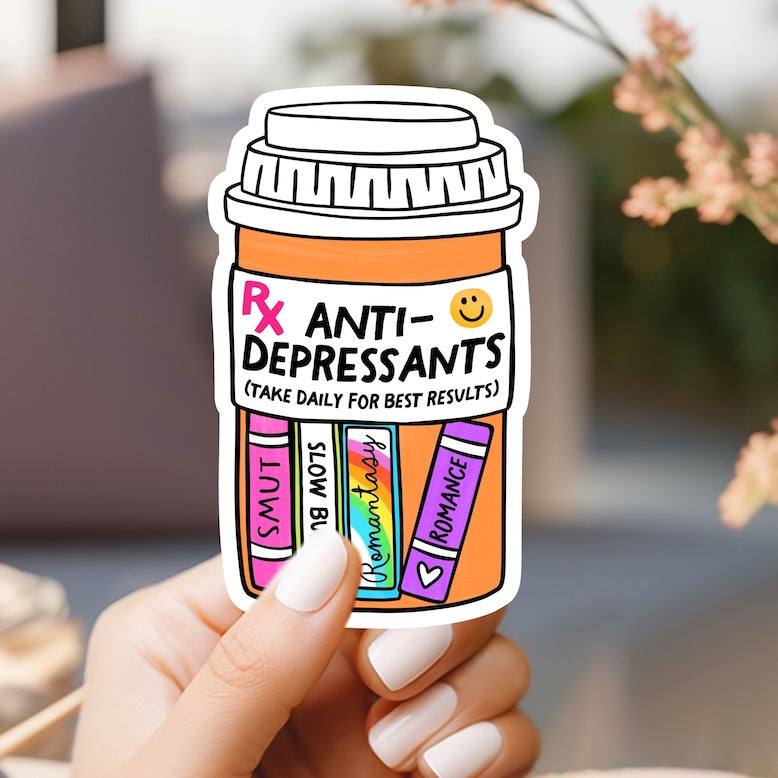 a person holding up a sticker of a jar of pills
