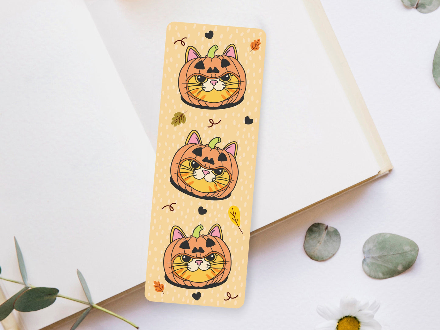 Bookmark of a Ginger Cat wearing a pumpkin hat.