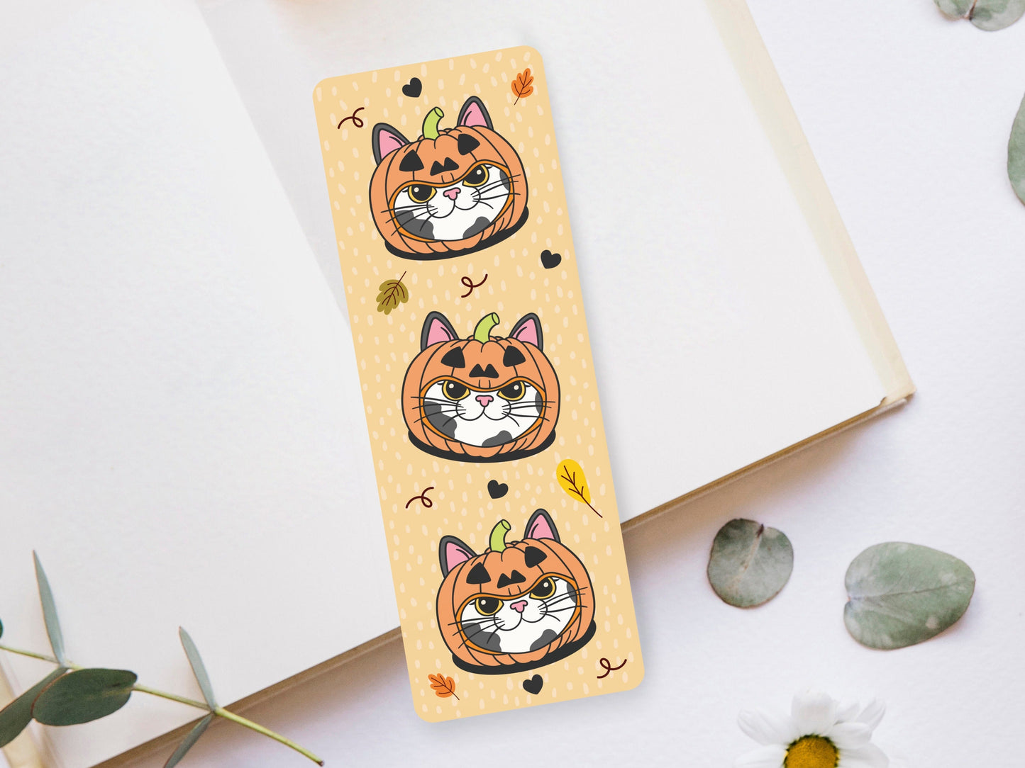 Bookmark of a Gray Bicolor Cat wearing a pumpkin hat.
