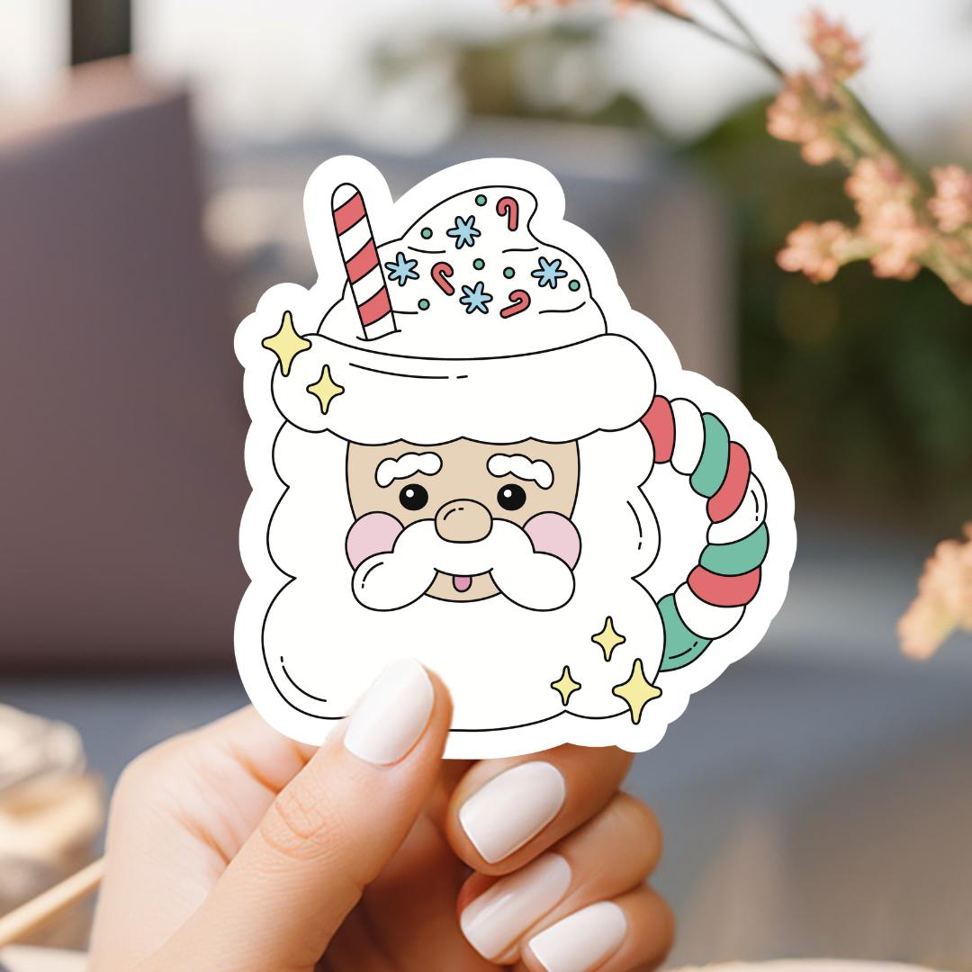 a person holding a sticker with a santa clause on it