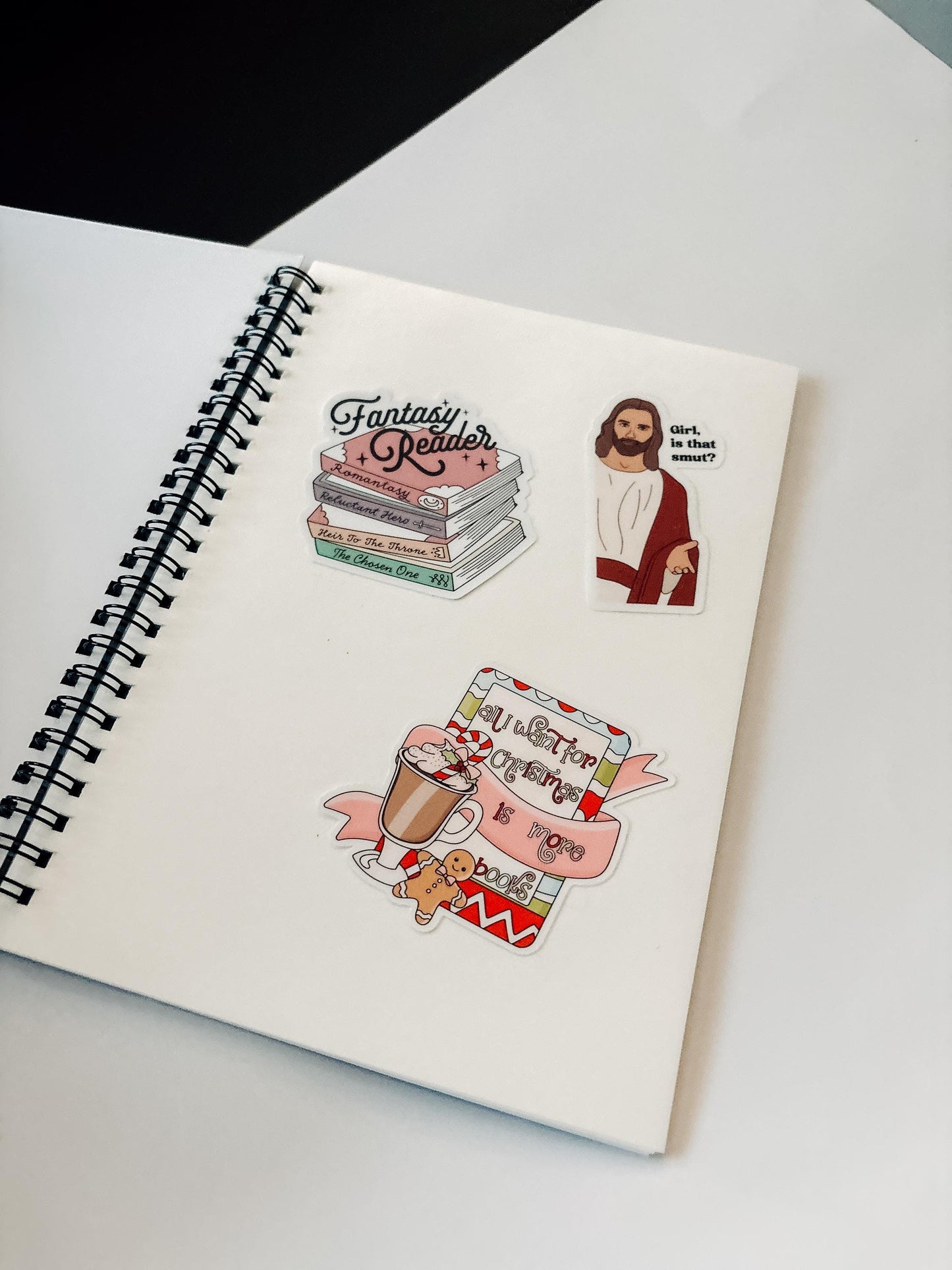 a notebook with stickers on it sitting on a table