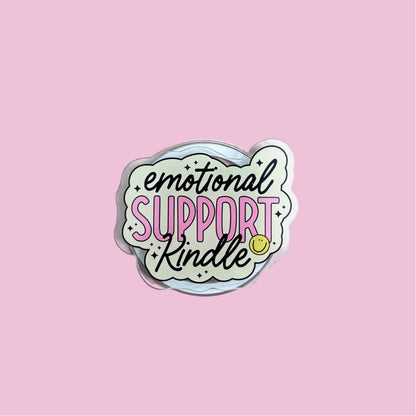 a pink background with a white cloud-shaped sticker containing the text "emotional support kindness" in a stylized font.