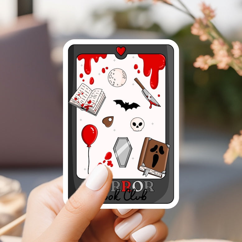 a person holding up a card with various items on it