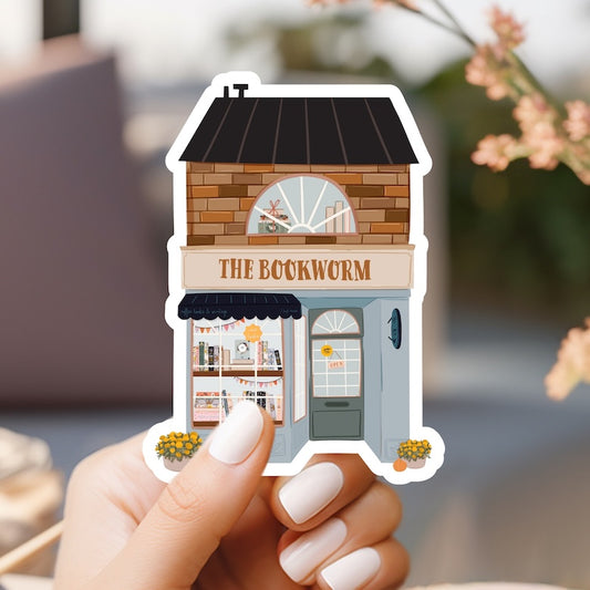 a person holding up a sticker of a store