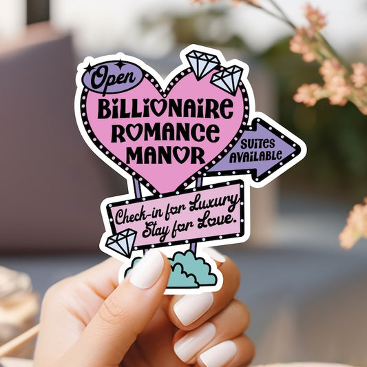a person holding up a pink heart shaped sticker