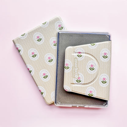 two small, square-shaped cases with a floral pattern on a pink background.