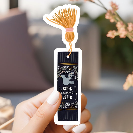 a person holding a book club sticker in their hand
