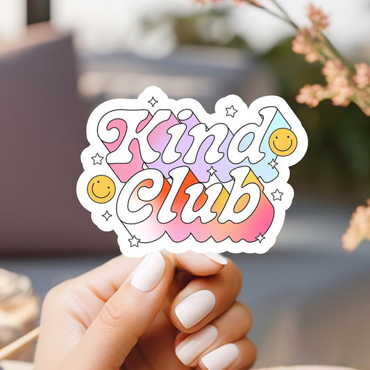 a hand holding a sticker that says kind of club