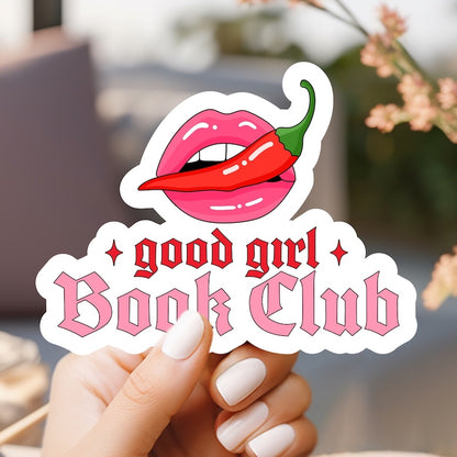 a woman holding up a sticker that says good girl book club