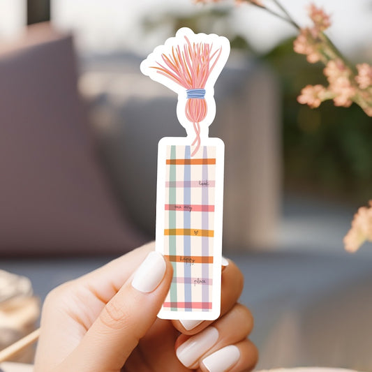 a person holding a sticker with a flower on it