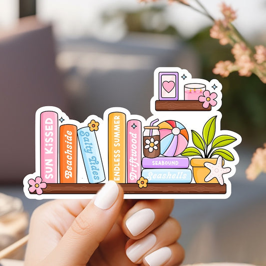 a person holding up a sticker with books on it