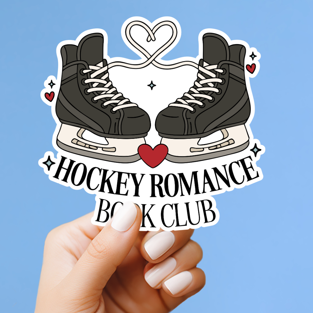 A hand holding a sticker with a pair of ice skates and a heart symbol, along with the text "Hockey Romance Book Club".