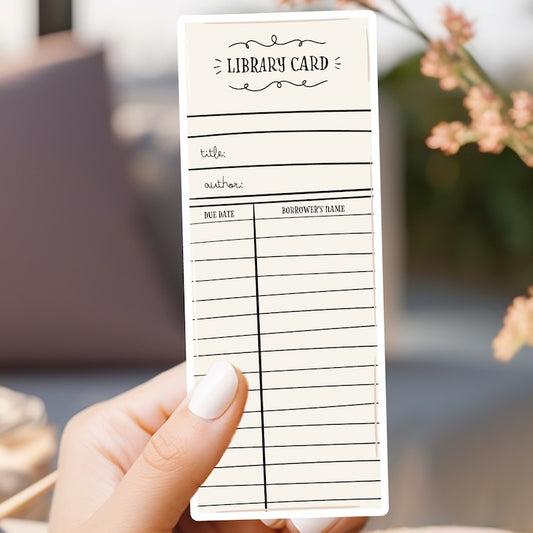 a person holding a library card in their hand