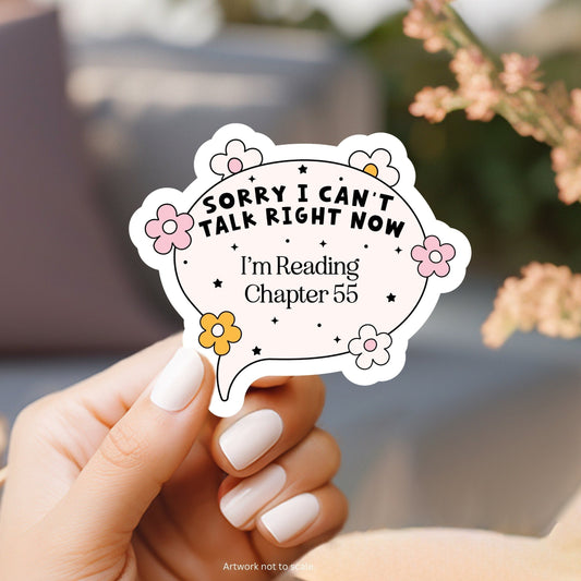 a person holding a sticker that says sorry i can&#39;t talk right now