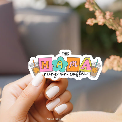 a person holding a sticker that says this mama runs on coffee