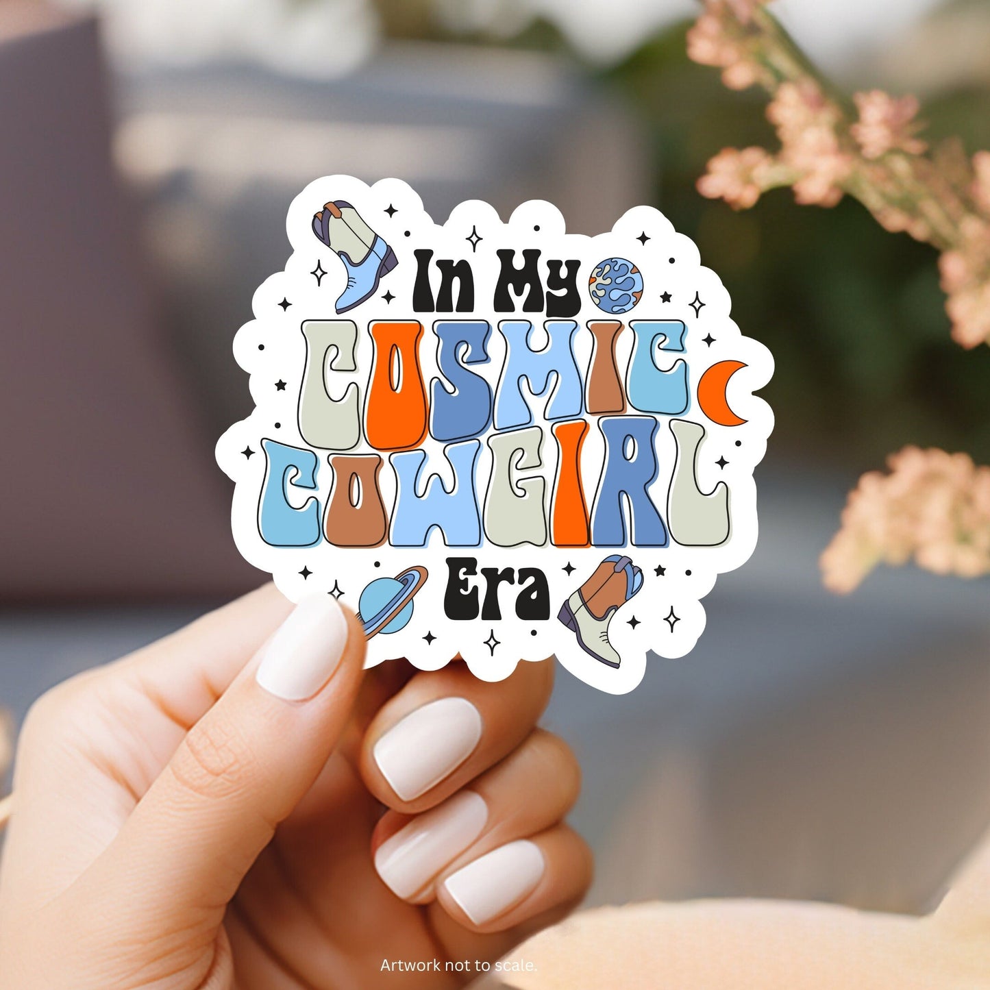 a hand holding a sticker that says i&#39;m my cosmic weird era