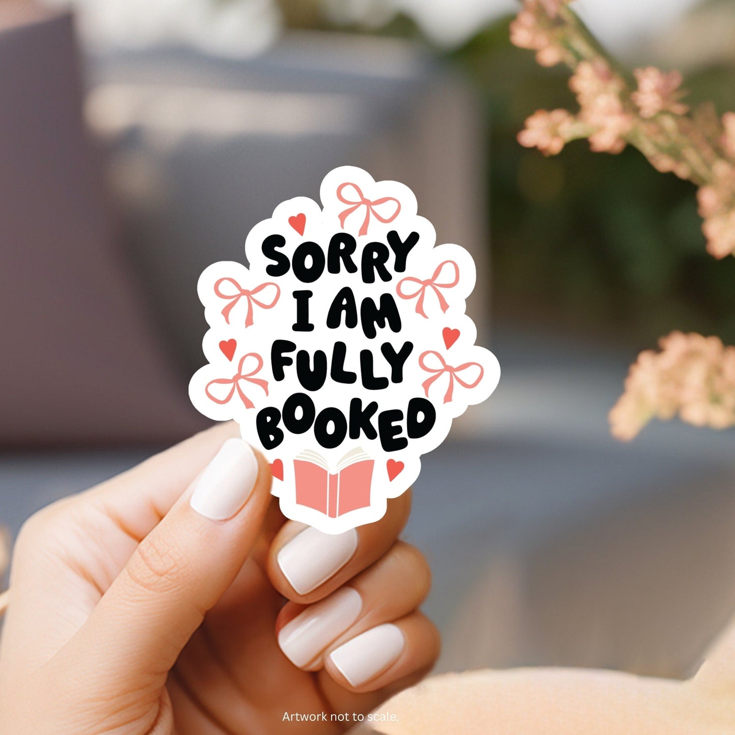 a person holding a sticker that says sorry i am fully booked