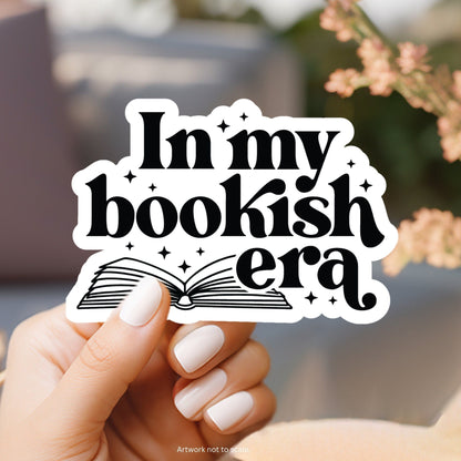 a person holding up a sticker that says i&#39;m my bookish era