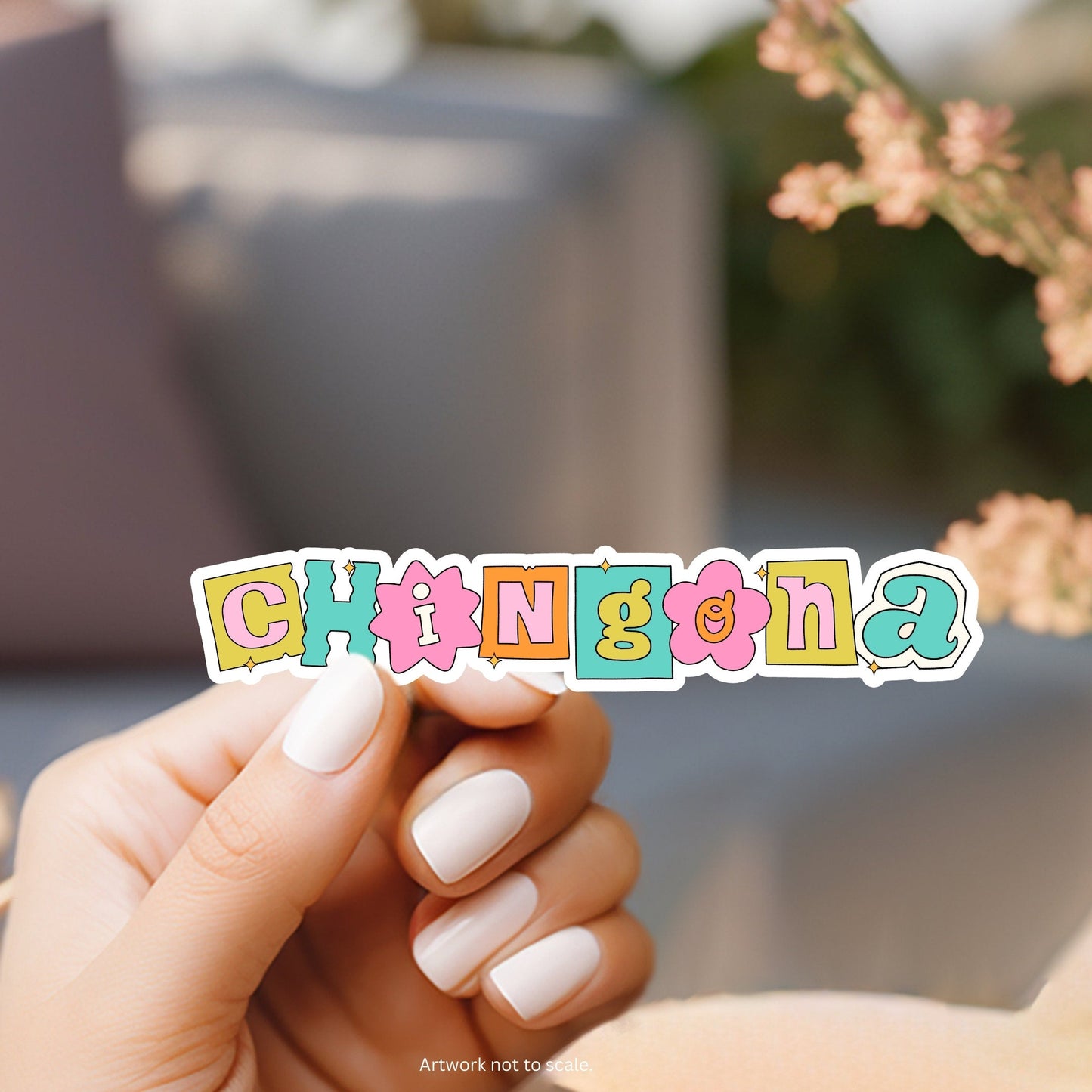 a hand holding a sticker that says spring