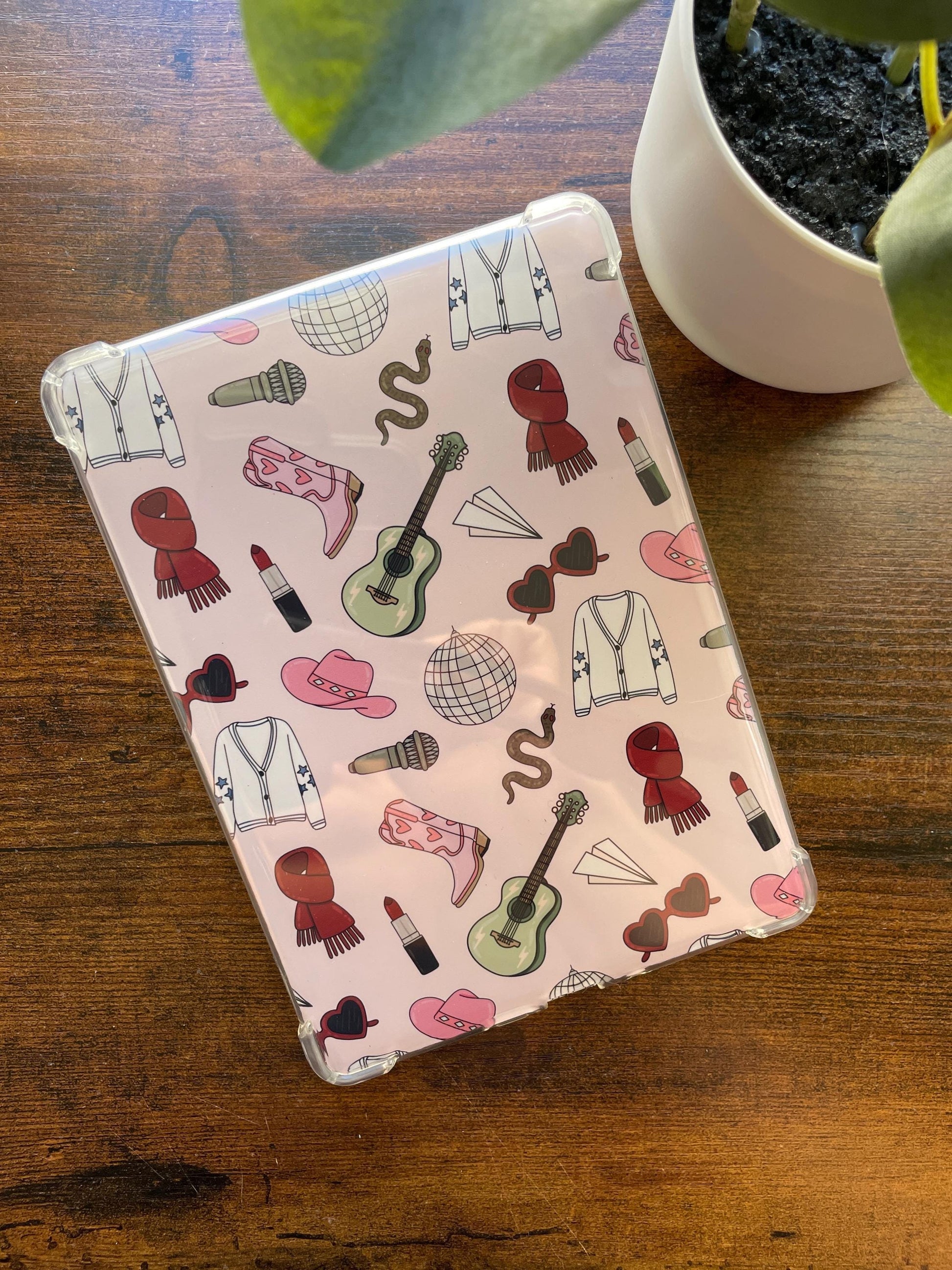 a tablet with a pattern of musical instruments on it