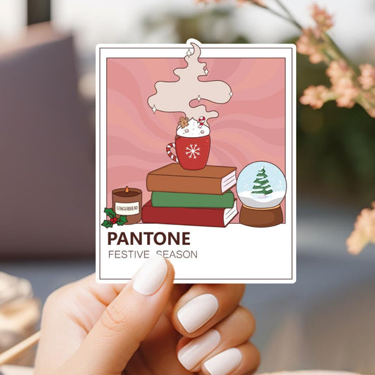 a person holding up a card with a picture of a stack of books and a