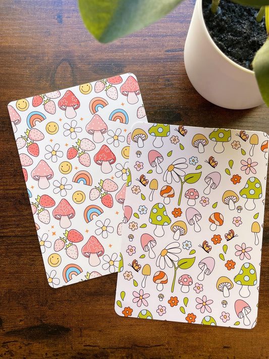 a potted plant sitting next to a pair of paper coasters