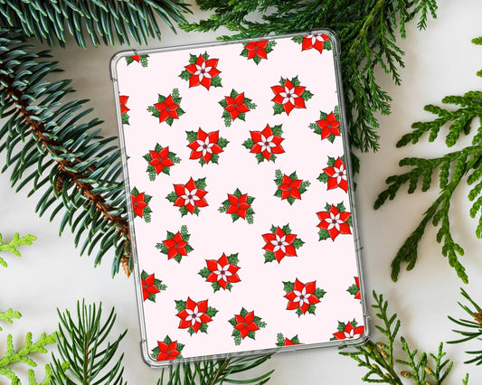 a white tablet covered in red and green poinsettias