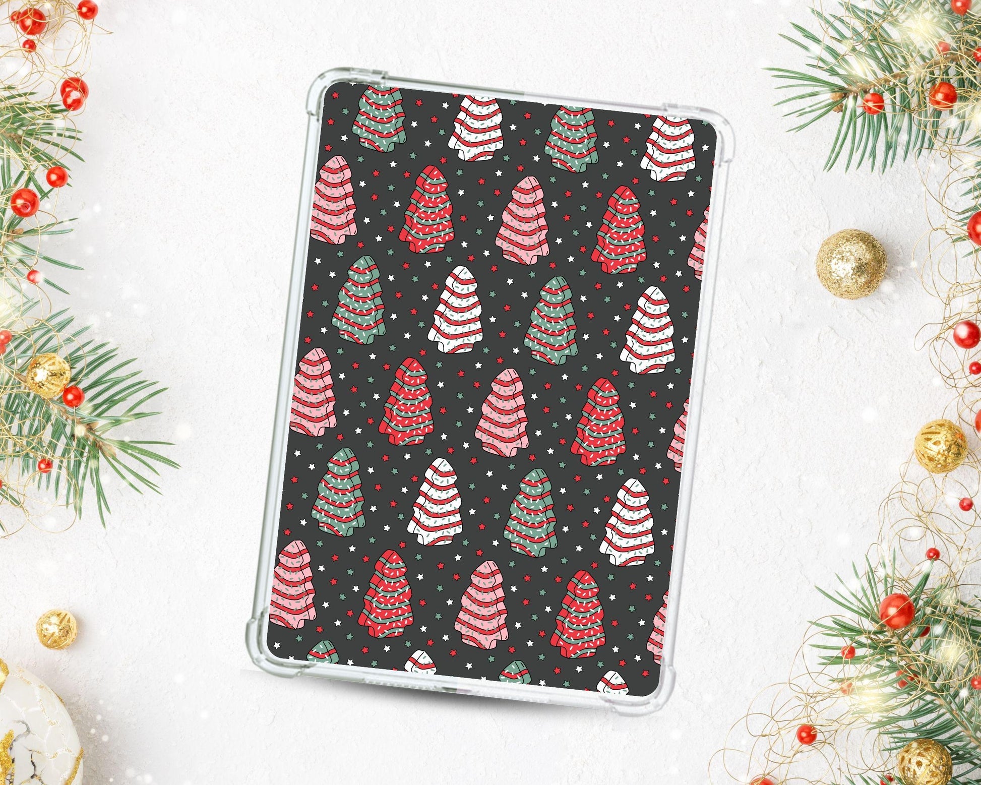 a tablet case sitting on top of a table next to christmas decorations