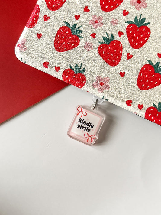 a white laptop with a red strawberry pattern on it